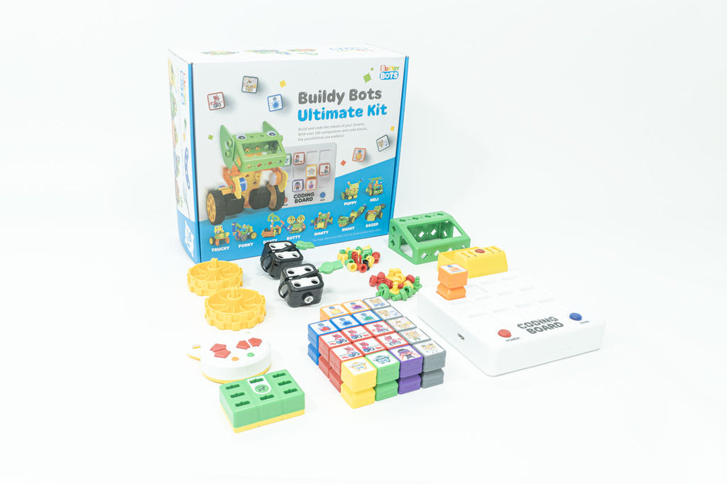 Buildy Bots Ultimate Kit and its parts laid out in front of the box, which include buttons, sensors, kid-safe tools, a coding board, coding blocks, motors, and more.