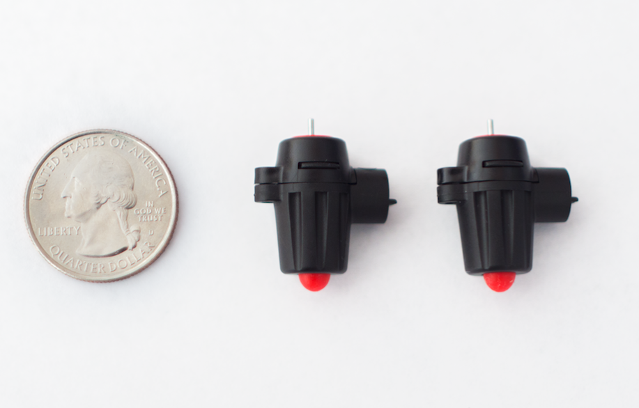 2 CoDrone Pro motors next to a US currency quarter for size