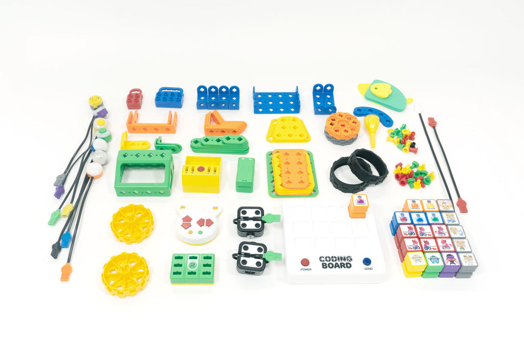 The full set of components in the Buildy Bots Ultimate Kit, which include buttons, sensors, kid-safe tools, a coding board, coding blocks, motors, and more.